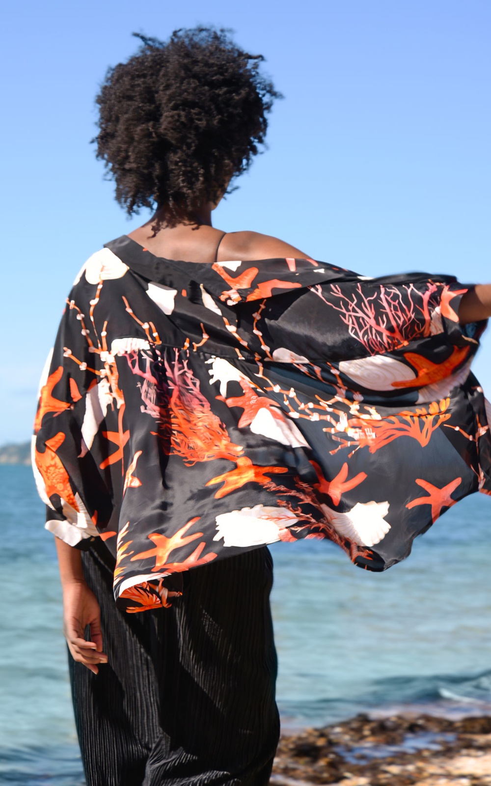 Behind Her Back Shirt product photo.